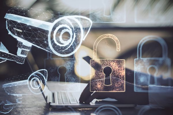 hands-using-laptop-with-polygonal-security-camera-2026-03-26-04-45-02-utc