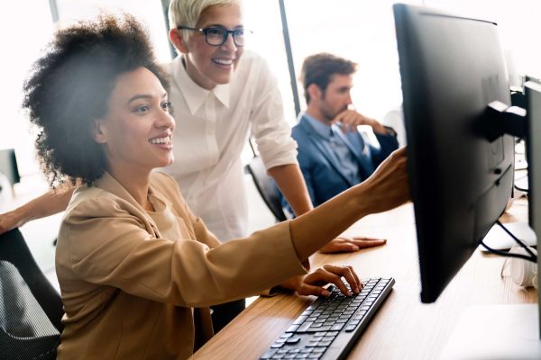 Programmers cooperating at IT company developing apps Strategic Campaign