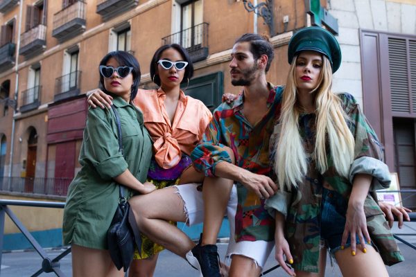 Stylish people sitting on fence fashion