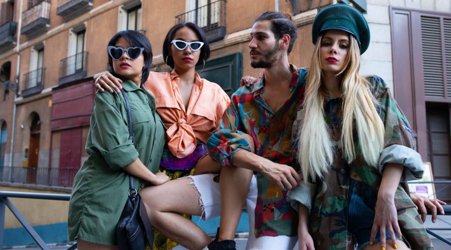 Stylish people sitting on fence fashion
