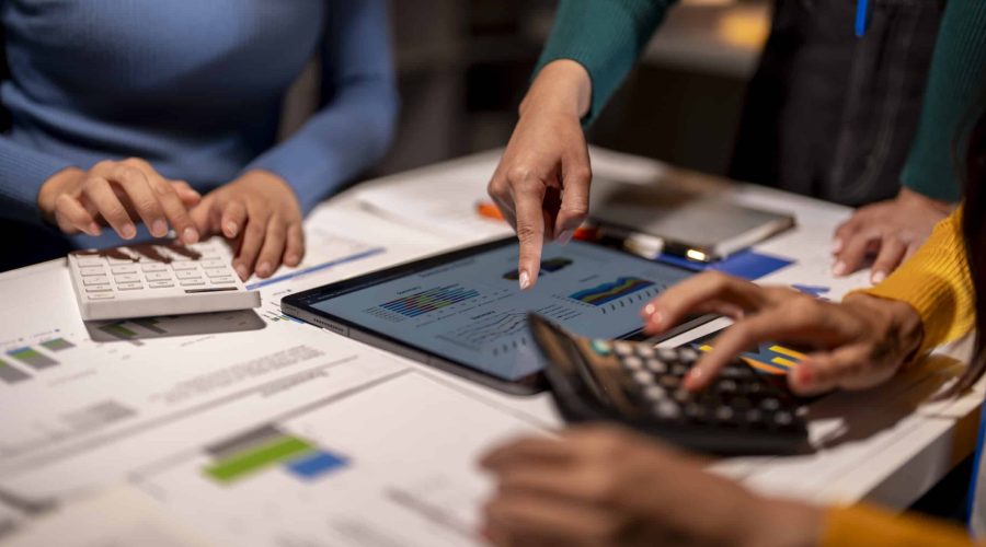 Three people are working on a project finance